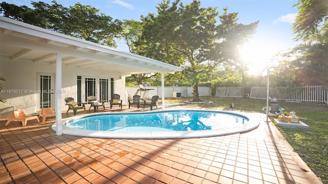 view of swimming pool featuring a patio