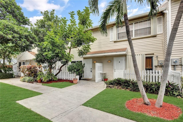 view of property featuring a front yard