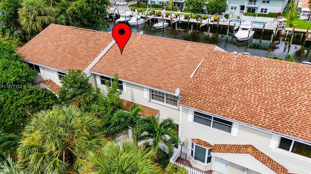 birds eye view of property featuring a water view