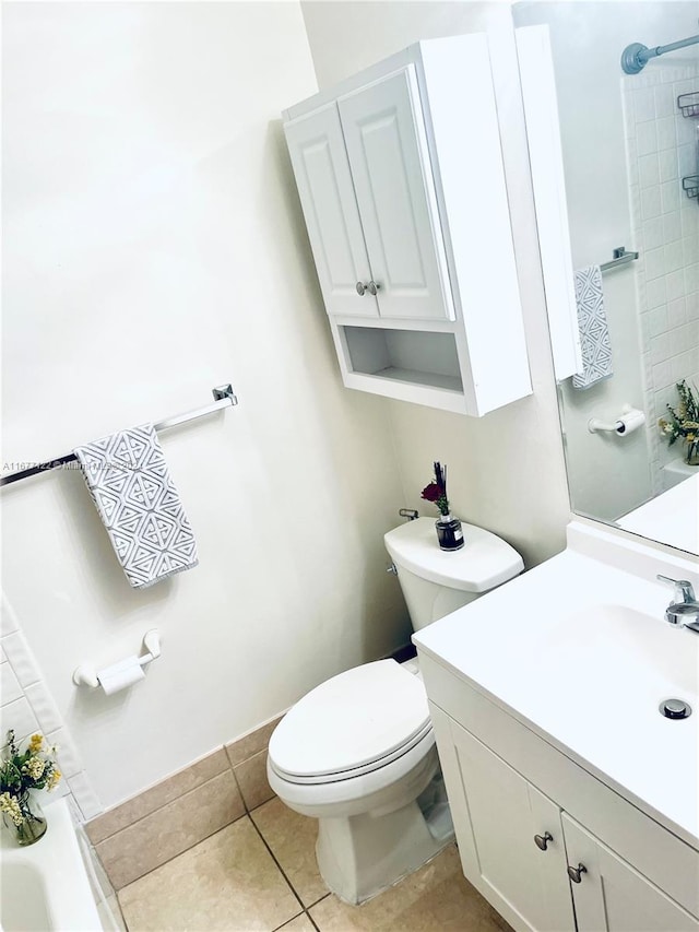 bathroom featuring vanity, tile patterned floors, and toilet