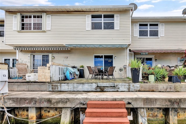 back of property featuring a patio area