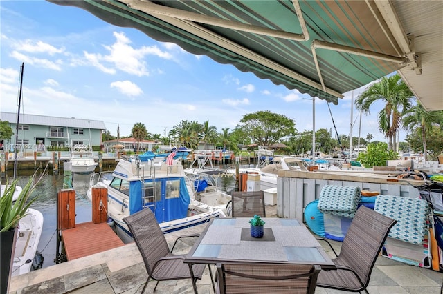 view of patio with a water view