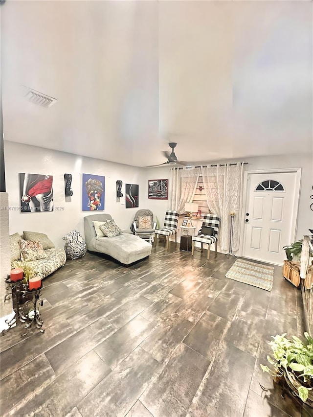 living room with ceiling fan and wood-type flooring