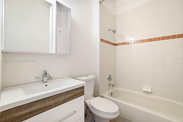 full bathroom featuring vanity, toilet, and tiled shower / bath combo