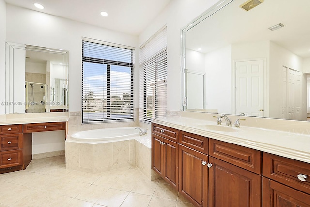 bathroom with vanity, shower with separate bathtub, and tile patterned floors