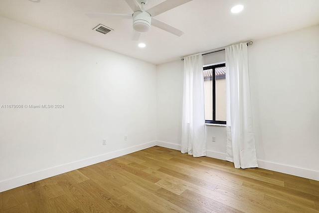 empty room with wood-type flooring and ceiling fan