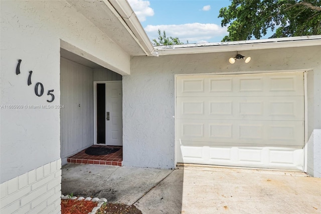 entrance to property featuring a garage