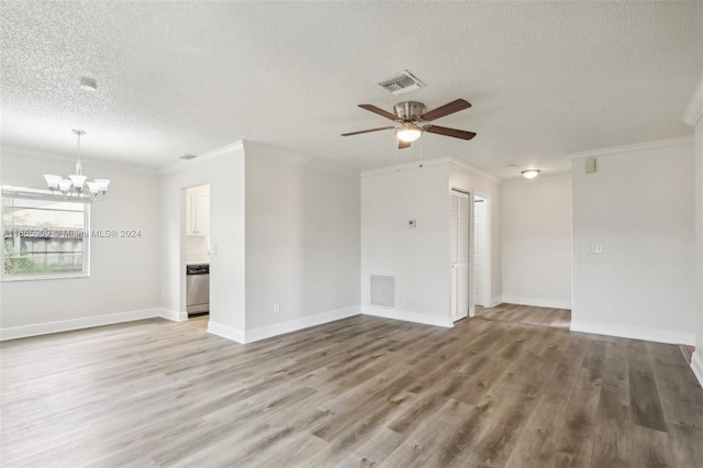 empty room featuring ornamental molding, a textured ceiling, light wood-type flooring, and ceiling fan with notable chandelier