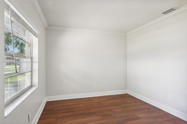 unfurnished room featuring ornamental molding, a textured ceiling, and dark hardwood / wood-style flooring