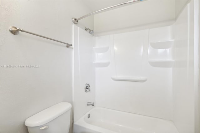 bathroom featuring toilet and shower / washtub combination