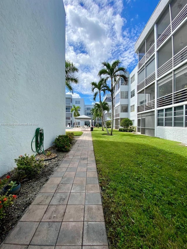 surrounding community featuring a lawn