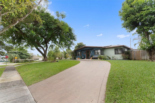 ranch-style house featuring a front lawn