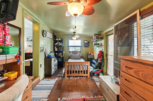 dining area featuring ceiling fan and dark hardwood / wood-style flooring