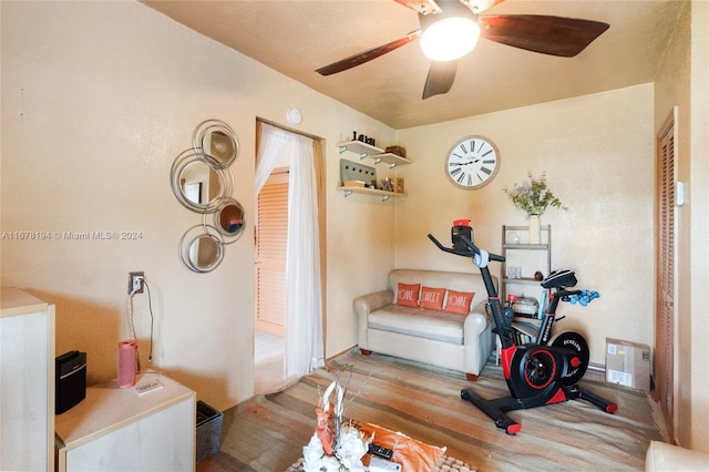 sitting room featuring light hardwood / wood-style flooring and ceiling fan