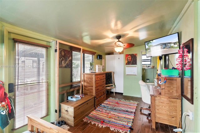 bedroom with ceiling fan and dark hardwood / wood-style flooring