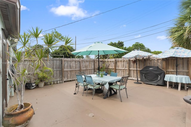 view of patio featuring a grill