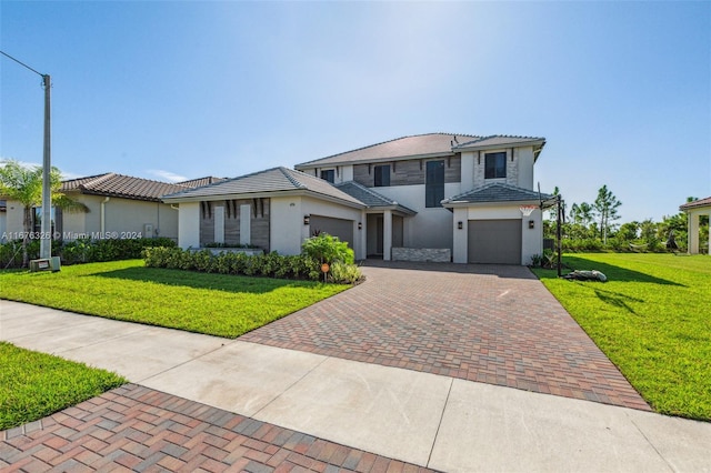 view of front of home with a front yard and a garage