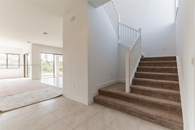 staircase with tile patterned flooring