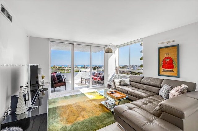 living room featuring floor to ceiling windows and hardwood / wood-style floors