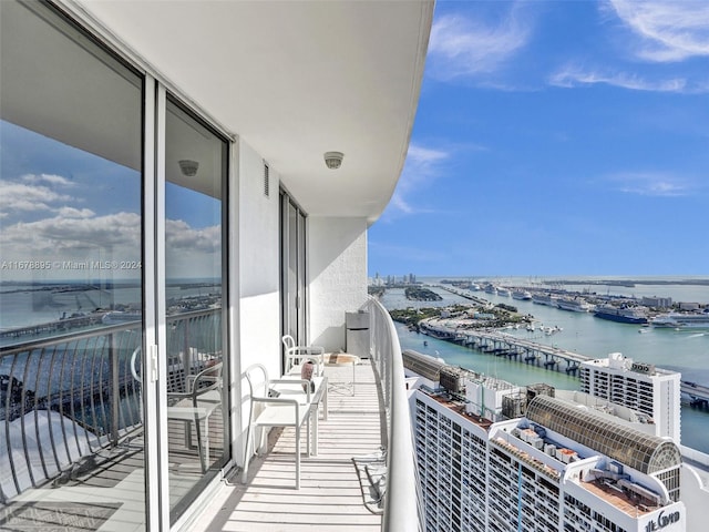 balcony featuring a water view