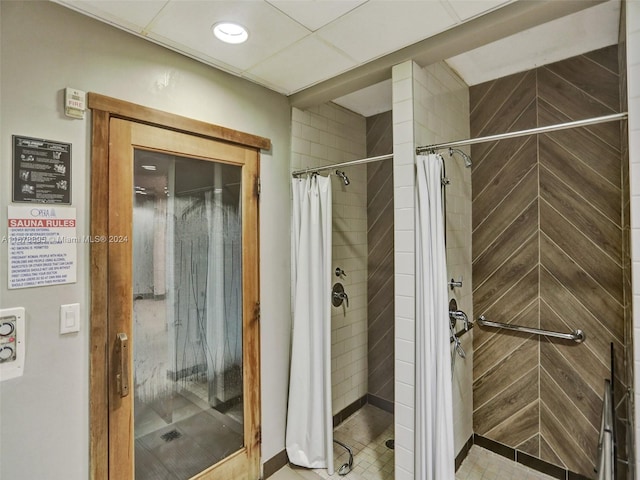 bathroom featuring a shower with shower curtain and tile patterned flooring