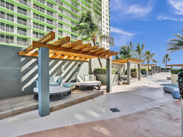 view of patio featuring a pergola and an outdoor hangout area