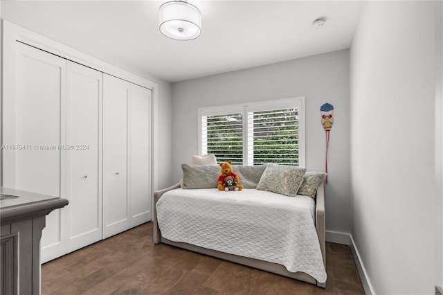 bedroom featuring a closet and dark hardwood / wood-style flooring