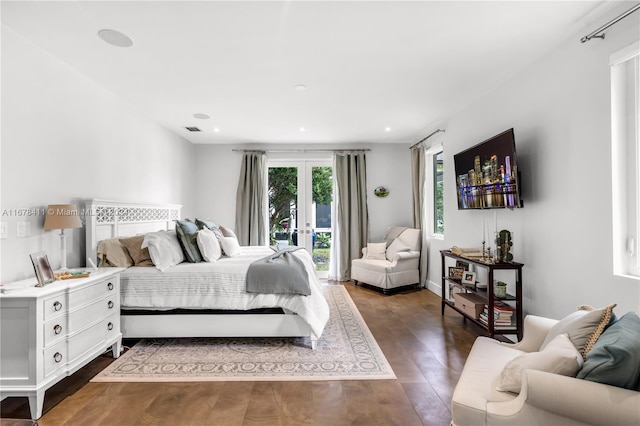 bedroom with dark wood-type flooring, access to outside, and french doors