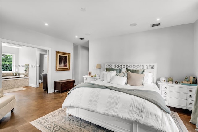 bedroom featuring ensuite bath