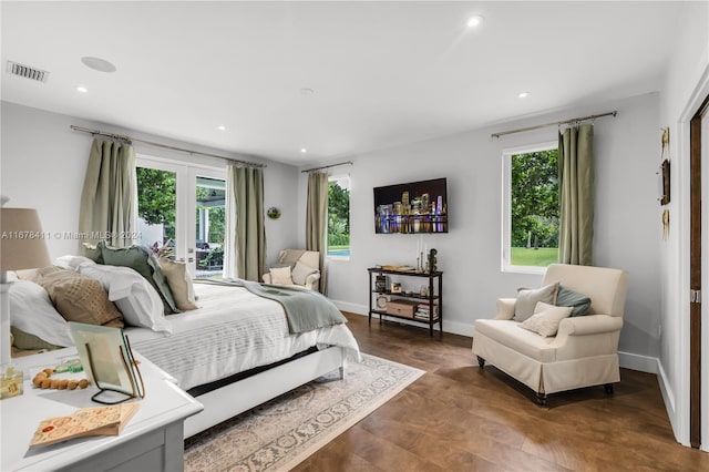 bedroom featuring french doors, dark hardwood / wood-style flooring, and access to exterior