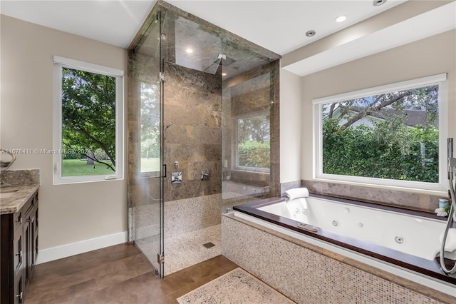 bathroom with vanity and plus walk in shower