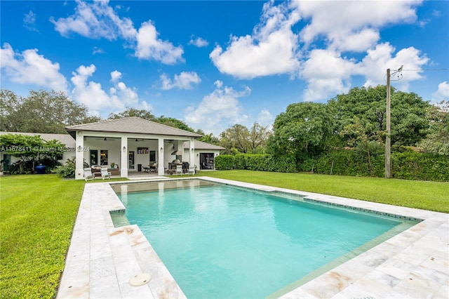 view of pool featuring a patio, a yard, and ceiling fan