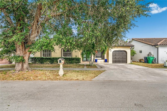 view of front of home with a garage