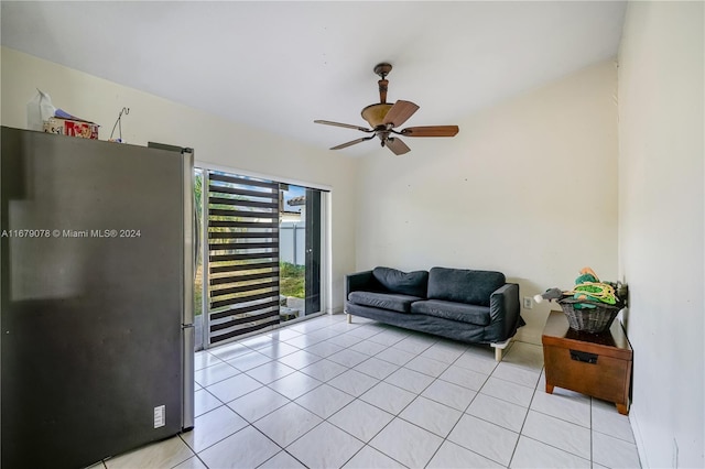 tiled living room with ceiling fan