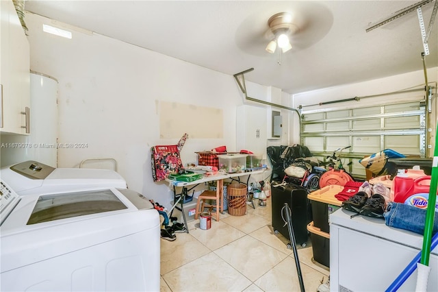 laundry room featuring ceiling fan, electric panel, washer and clothes dryer, and light tile patterned flooring