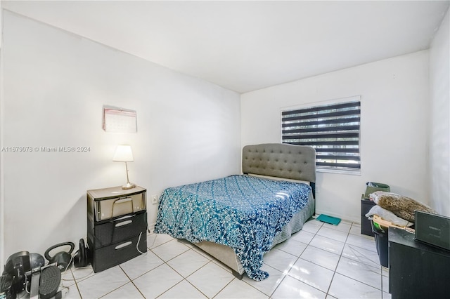 bedroom with light tile patterned floors