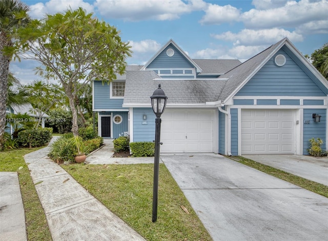 view of front facade featuring a front lawn and a garage