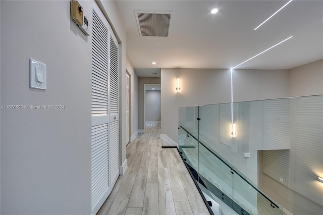 115 Ocean Dunes Cir, Jupiter, FL 33477 - hall featuring light wood finished floors, baseboards, and recessed lighting