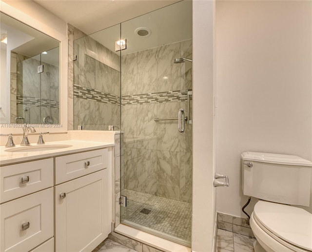 bathroom with vanity, toilet, and walk in shower