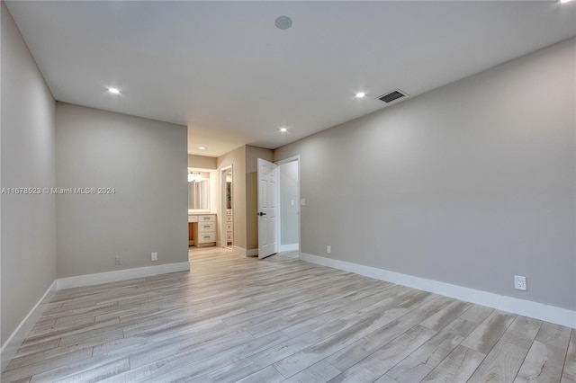 spare room featuring light hardwood / wood-style flooring