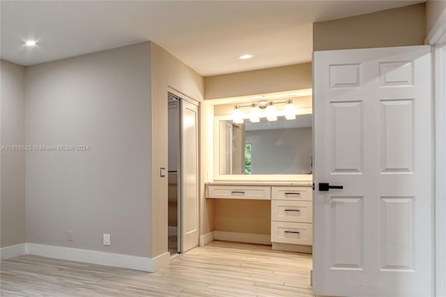 bathroom with hardwood / wood-style floors