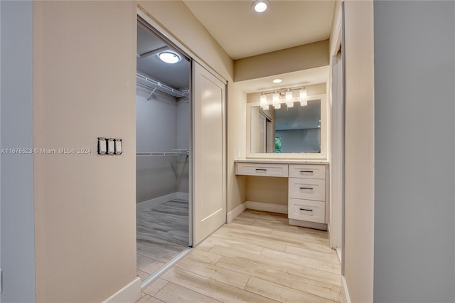 bathroom with hardwood / wood-style floors