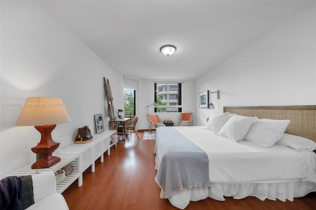 bedroom with wood-type flooring