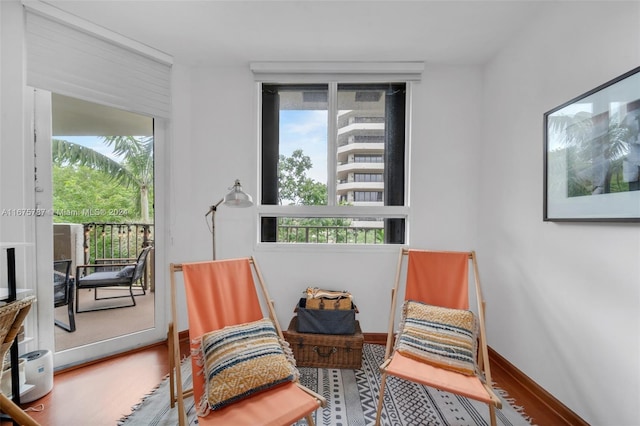 sitting room with hardwood / wood-style floors and a wealth of natural light