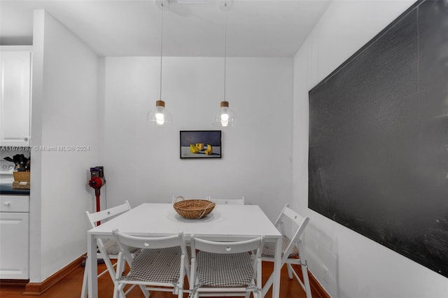 dining area featuring dark hardwood / wood-style floors