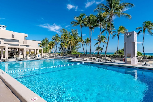 view of swimming pool with a water view