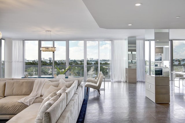 living room with an inviting chandelier and a wealth of natural light