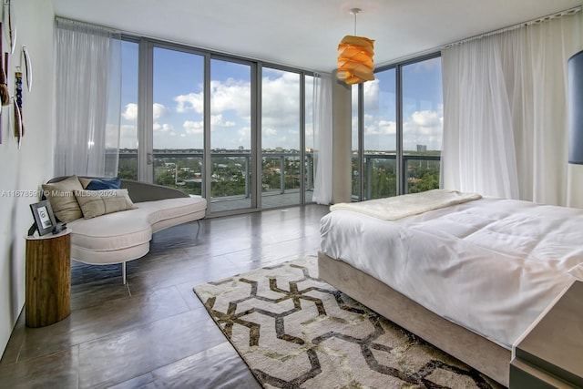 bedroom featuring access to outside and floor to ceiling windows