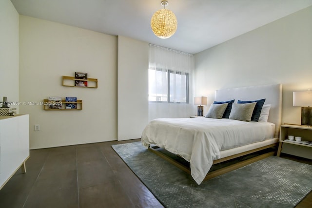 bedroom with dark wood-type flooring