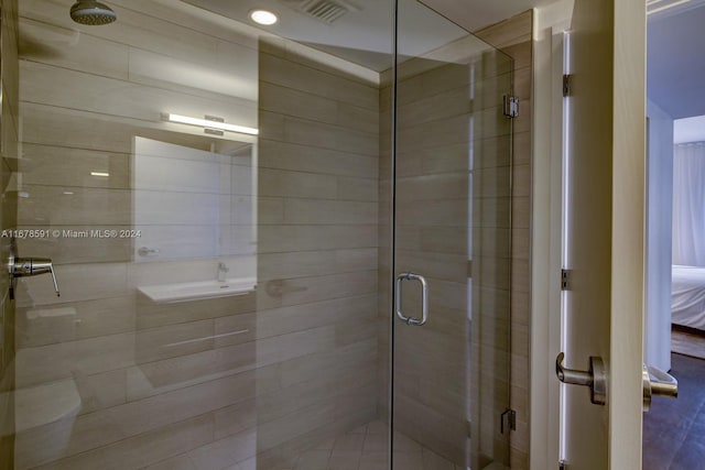 bathroom featuring an enclosed shower